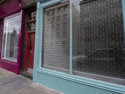 Exterior of colourful shop fronts in Glasgow City Centre